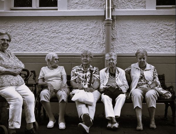 Five women seated.